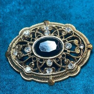 Elegant Goldtone and Black Brooch